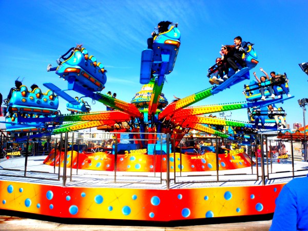 Enjoying the rides, Brighton Pier, UK.